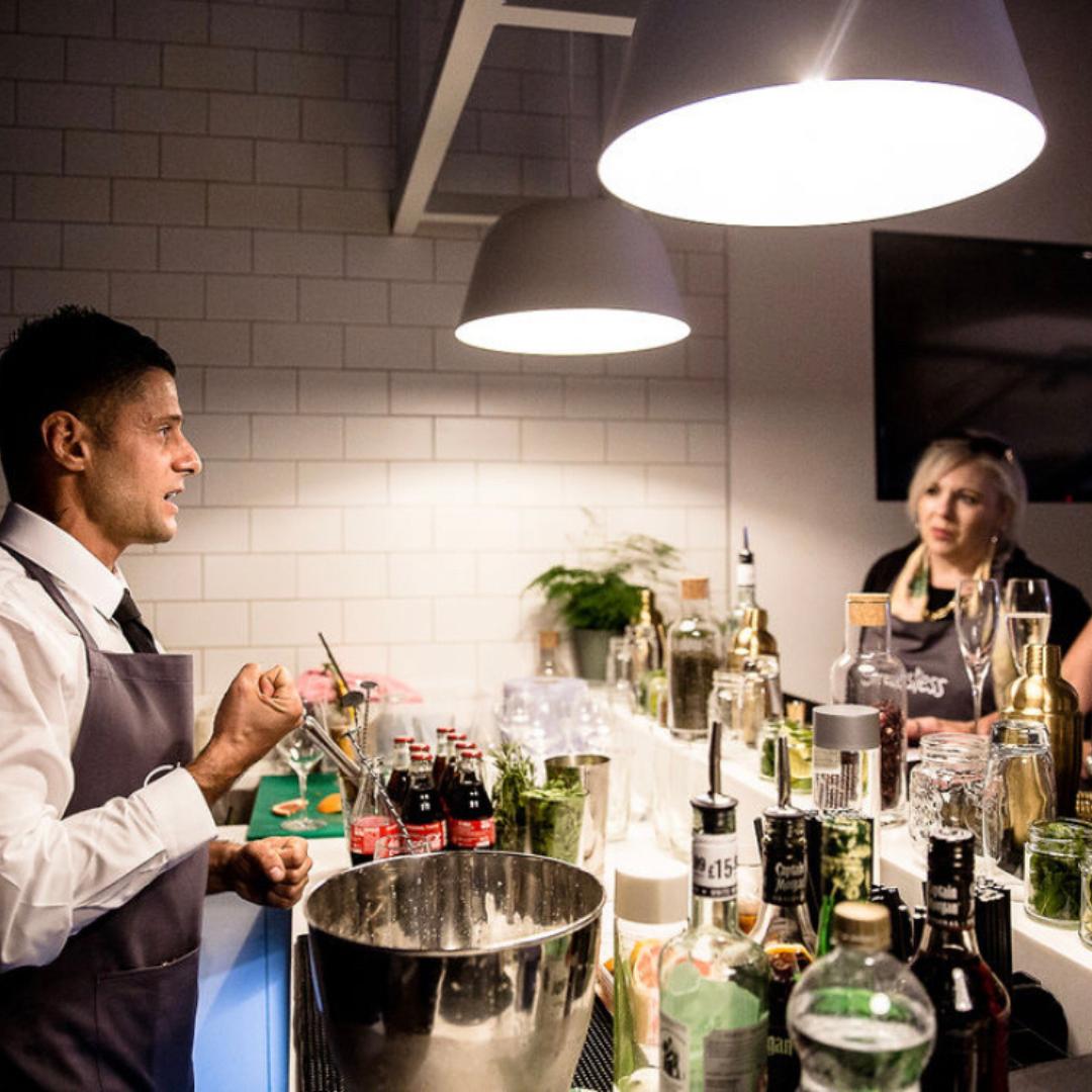 Cocktail masterclass mise-en-place with fresh herbs, citrus, spirits and mixing tools laid out as our bartenders demonstrate a recipe